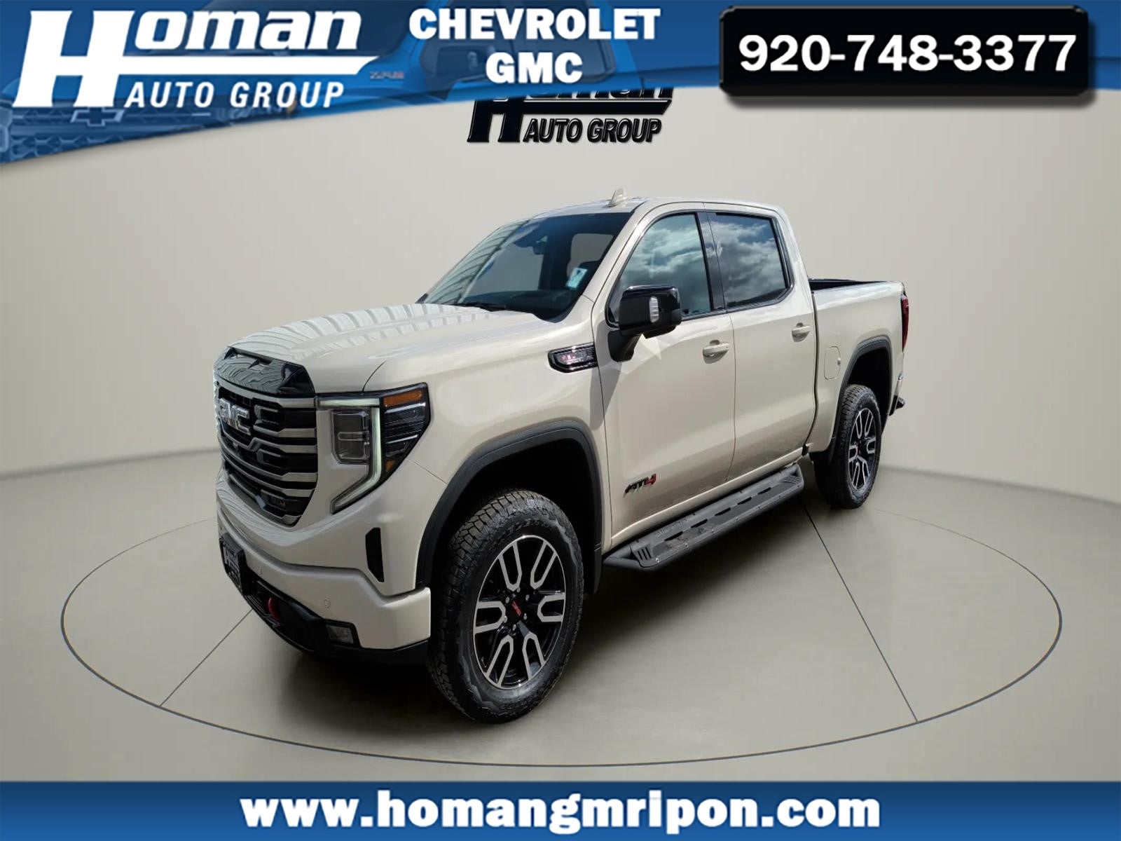 2026 GMC Sierra 1500 AT4 in Coastal Dune — front three-quarter view